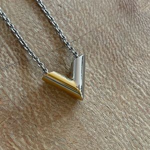Louis Vuitton V uniform necklace. Silver and gold.